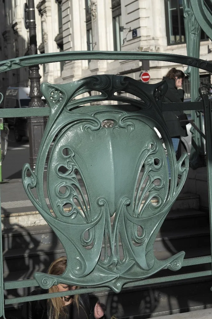 Railing escutcheon with "M"